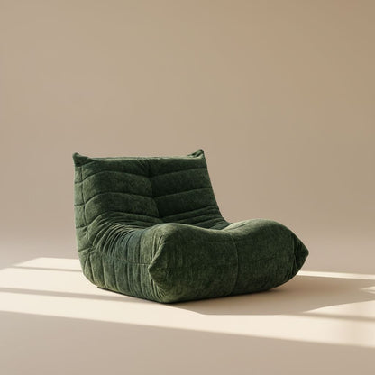 Green cushioned chair on a beige background